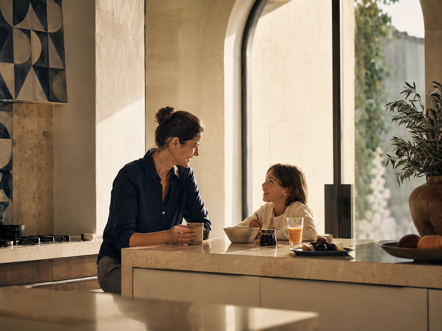 A mother and child sharing breakfast in a sunlit kitchen